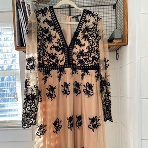 Stunning nude dress with black flowers V-neck